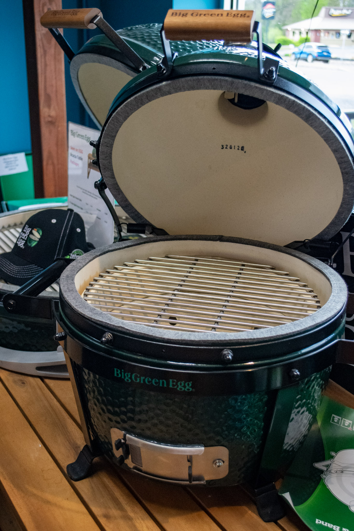 Big Green Egg display on acacia table